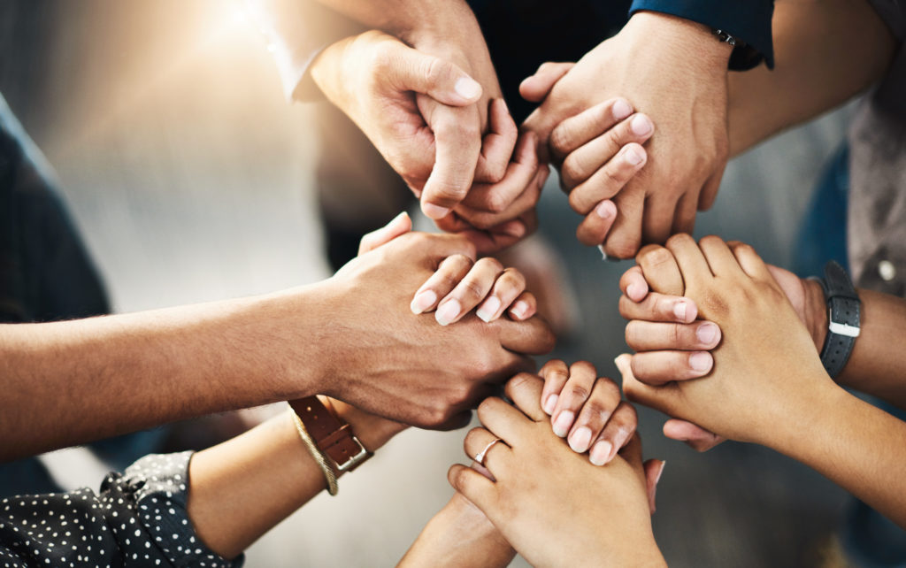 holding hands in a circle focus only on hands
